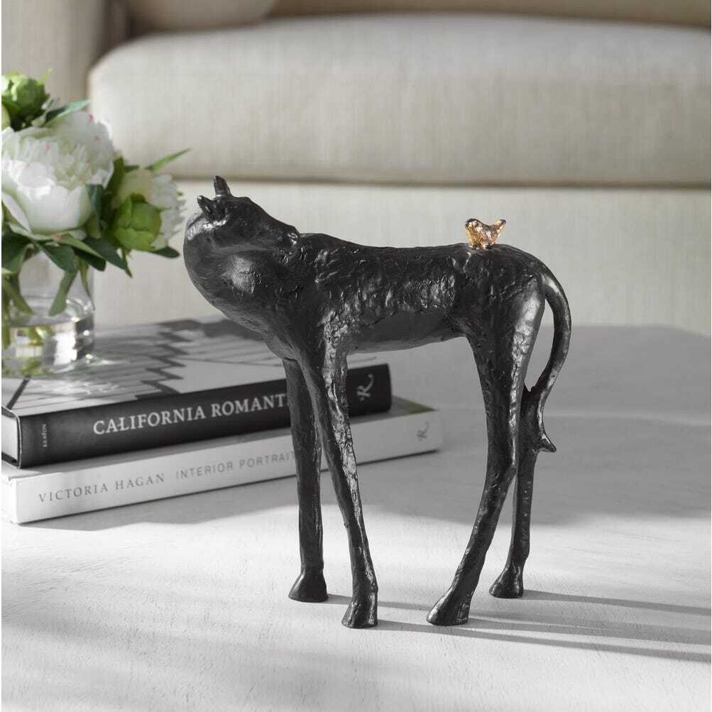  Cast iron sculpture of a dark brown horse turned to greet the gold bird on its back
