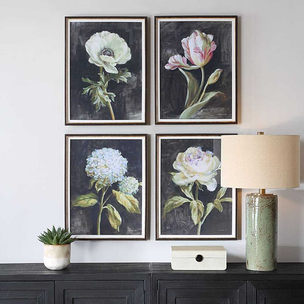 Set of four botanical prints in dark brown frames