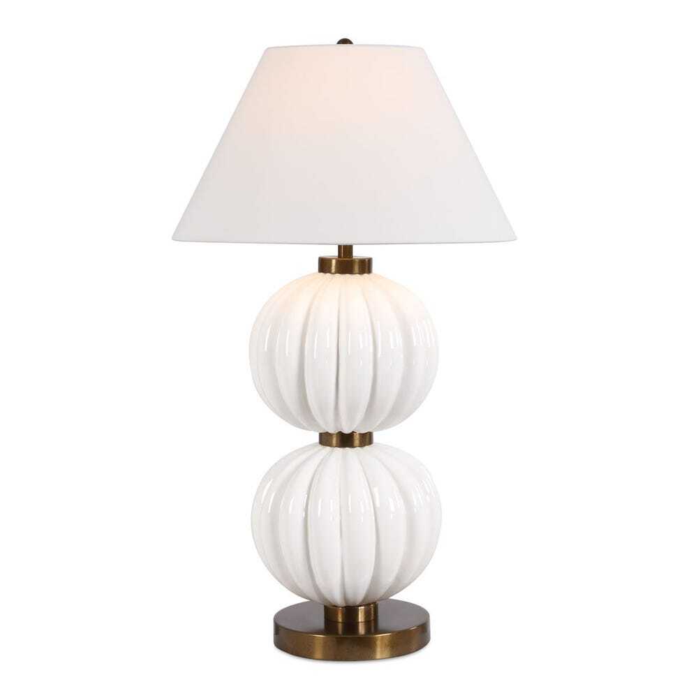 white lamp that has stacked ribbed spheres as a base and white lamp shade